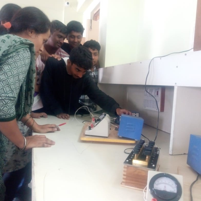 Senior students learning science lab practical using instruments at Darsh Universal School physics laboratory